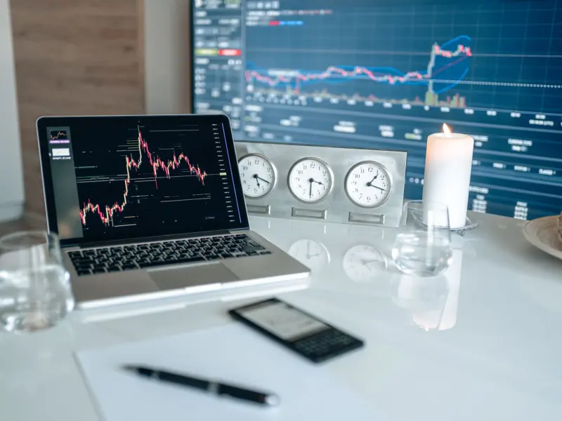 Forex charts and clocks on a trading desk